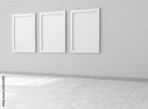 Interior empty room with three empty white picture frames on dark wall. Mock-up template for display, products, title or logo. Studio or blank office space. 3d illustration © Anatomy Insider