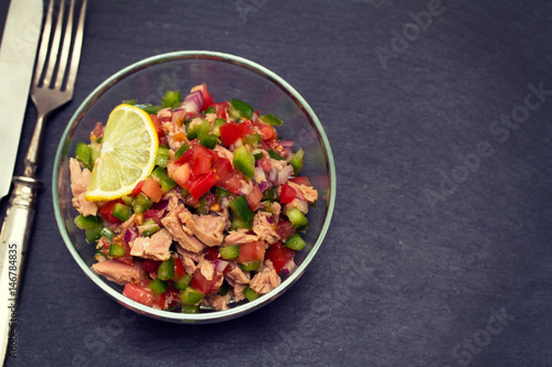 tuna salad with tomato and pepper in bowl