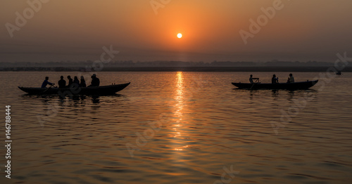 Beautiful view of sunrise with boats at Ganges River in Varanasi,  India