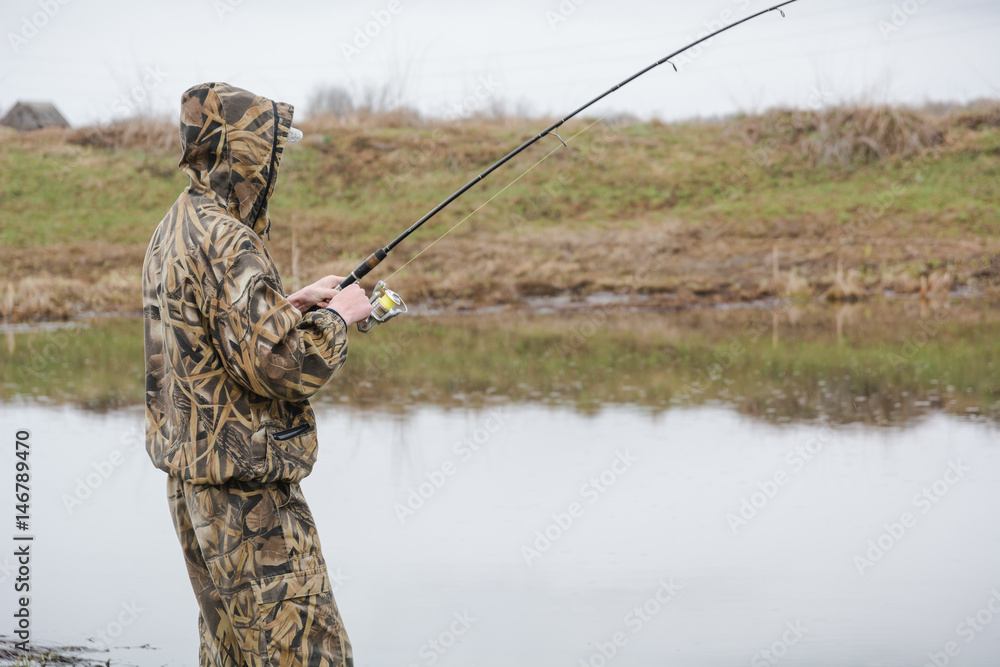 fishing on a spinning. catching of predatory fish. a pike on a spinning fishing on a spinning. catching of predatory fish. a pike on a spinning
