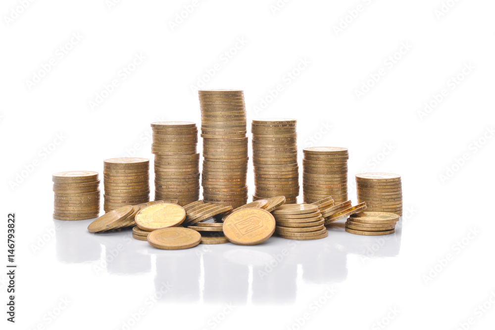 Coin stacks on a white background. Ukrainian hryvnia. Coin stacks on a white background. Ukrainian hryvnia.
