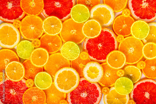 beautiful fresh sliced mixed citrus fruits like background, concept of healthy eating, dieting, top view