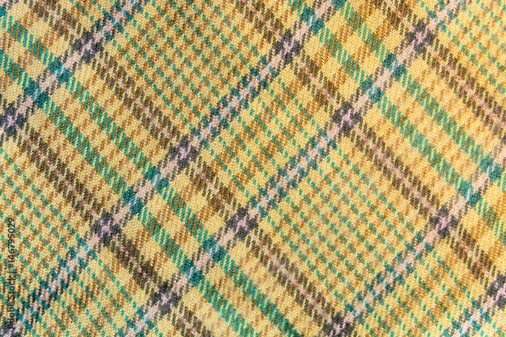 Texture, background of a tartan yellow fabric Texture, background of a tartan yellow fabric