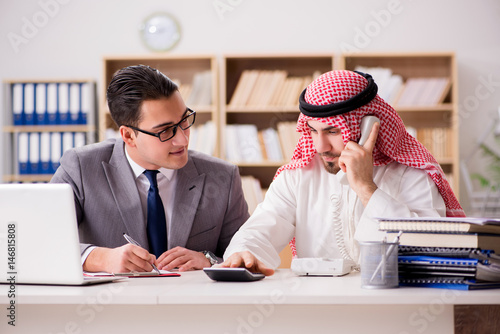 Diverse business concept with arab businessman photo