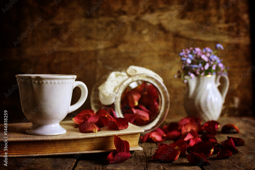 retro effect on photo vintage tea with rose dry petal
