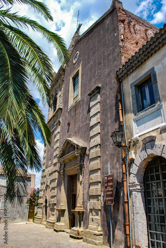 Forza d'Agro, Italy - August 06, 2009: Side view of the ancient church and augustine convent in sicilian town