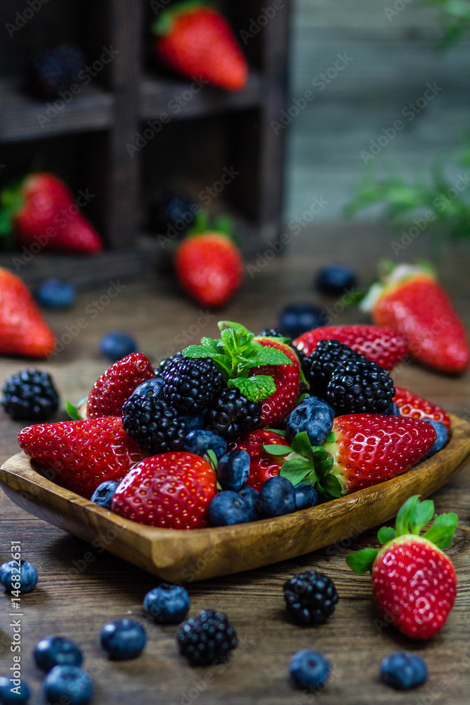 Mix Berries strawberries, blueberries, blackberries on Wooden Background. Summer Organic Berry over Wood. Agriculture, Gardening Mix Berries strawberries, blueberries, blackberries on Wooden Background. Summer Organic Berry over Wood. Agriculture, Gardening