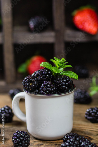 Wallpaper Mural blackberries and mint on Wooden Background. Summer Organic Berry over Wood. Agriculture, Gardening Torontodigital.ca