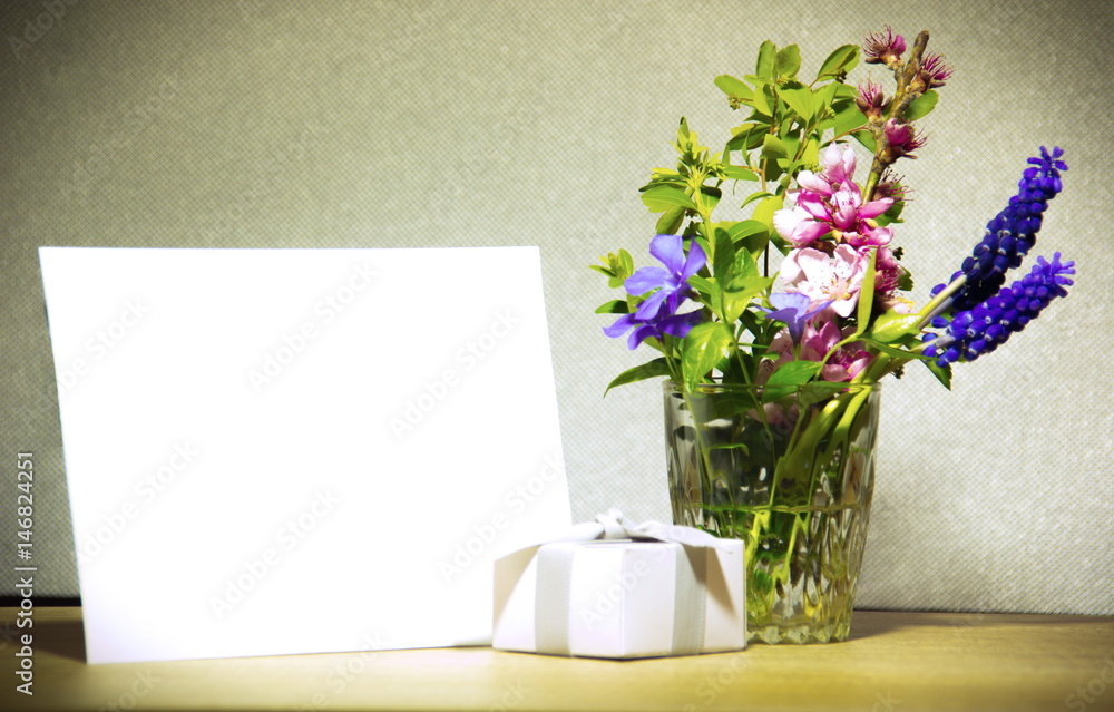 Blank card, present and flowers