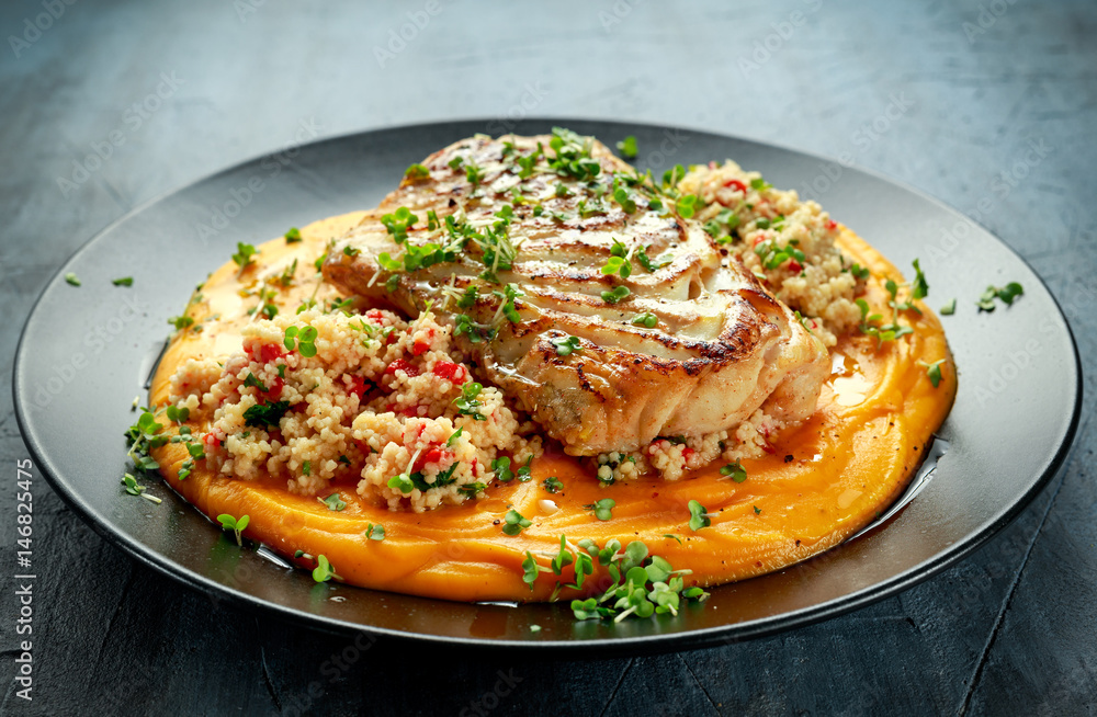 Soy-glazed cod loin fillet with cous-cous salad on butternut squash puree Soy-glazed cod loin fillet with cous-cous salad on butternut squash puree