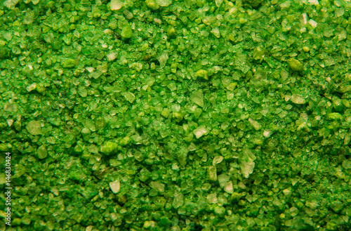 Sea salt background or texture in green color. Little minerals