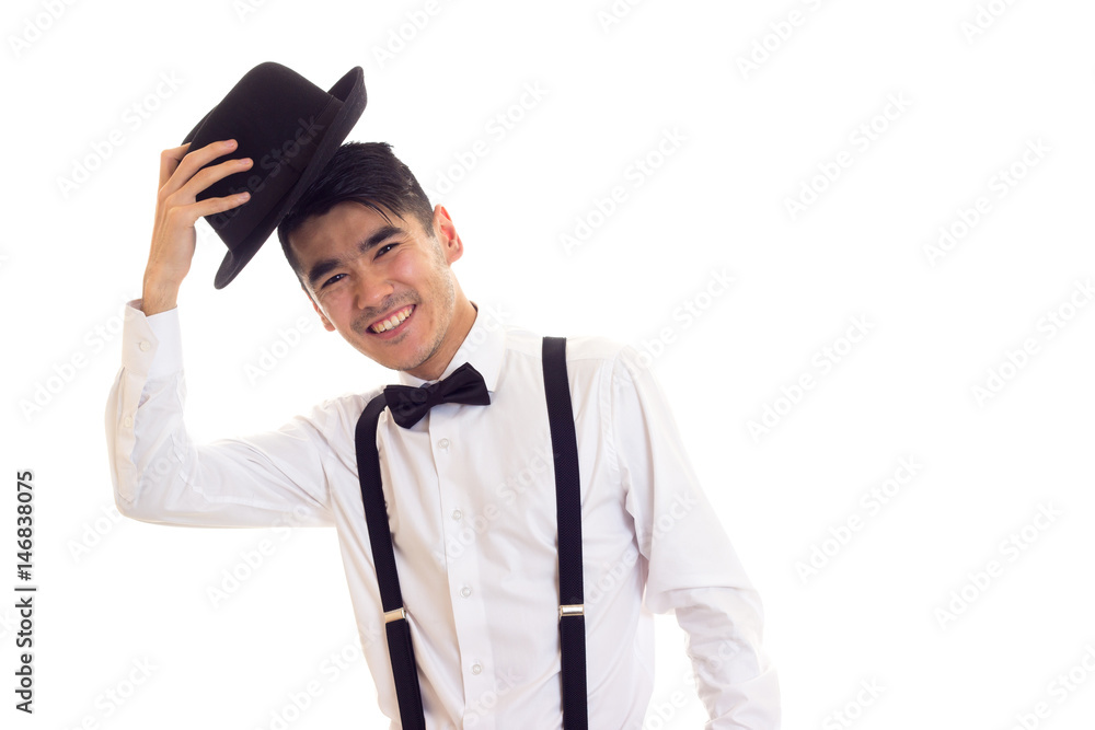 Young man with bow-tie, suspenders and hat Young man with bow-tie, suspenders and hat