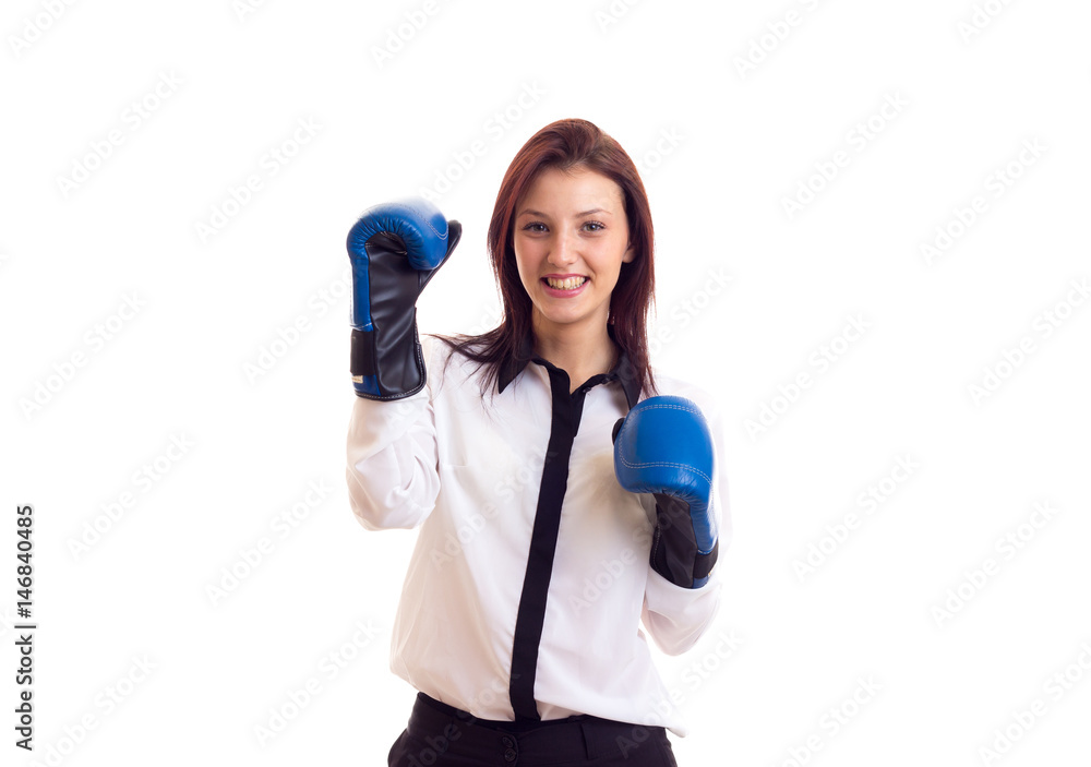 Young businesswoman in boxing gloves Young businesswoman in boxing gloves