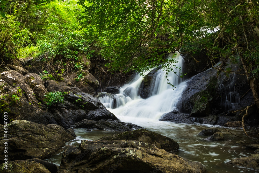 PHA KLUAI MAI waterfall with green trees and stones. PHA KLUAI MAI waterfall with green trees and stones.