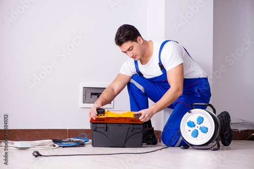 Man doing electrical repairs at home