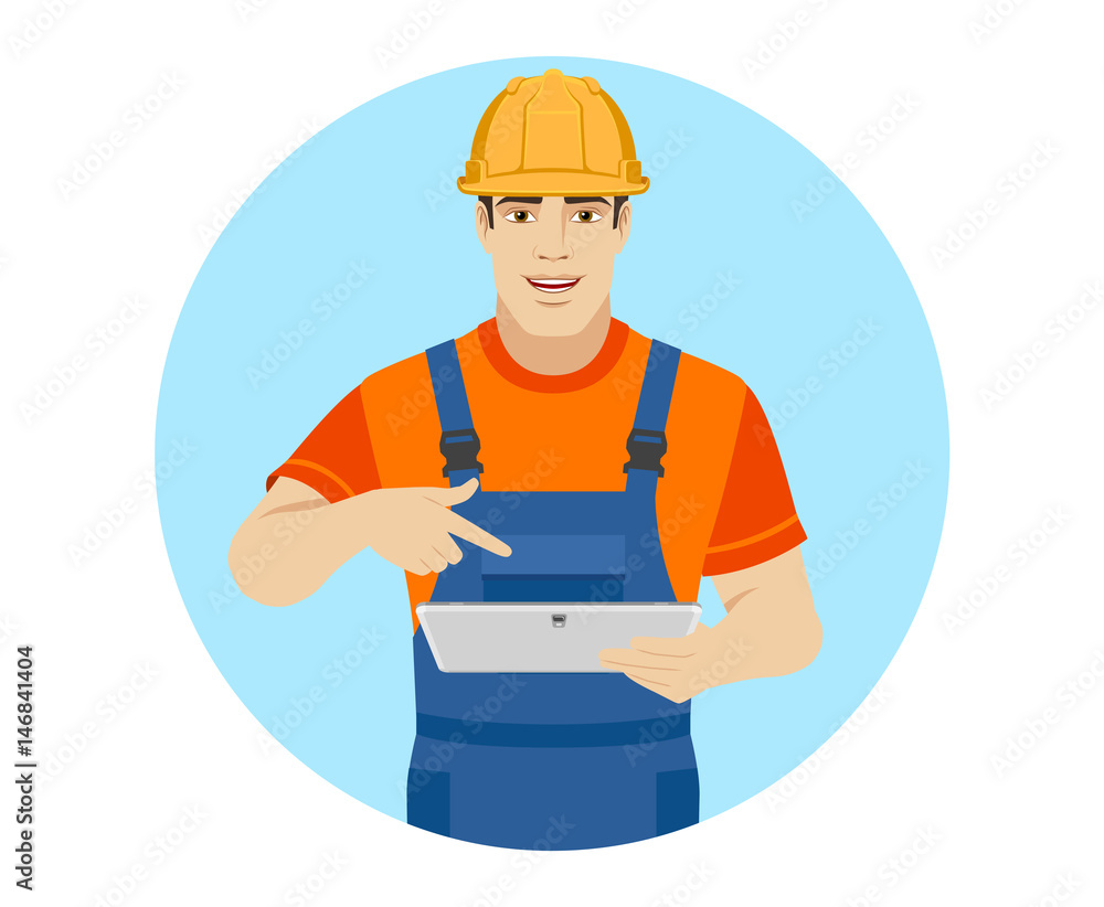 Builder pointing the finger to digital tablet PC Builder pointing the finger to digital tablet PC
