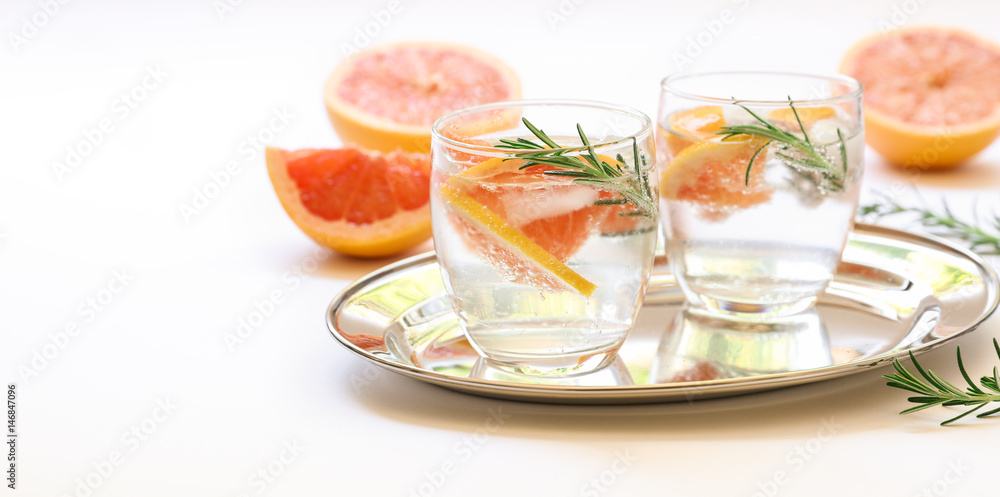 Detox drink with grapefruit, rosemary and ice. Detox drink with grapefruit, rosemary and ice.