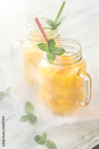 Mango juice in mason jars