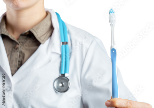 dentist showing toothbrush