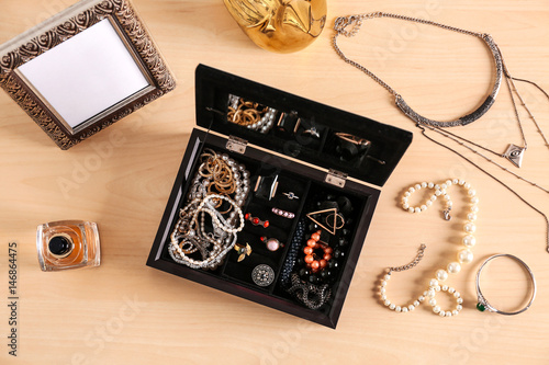 Jewelry accessories in box and table, top view