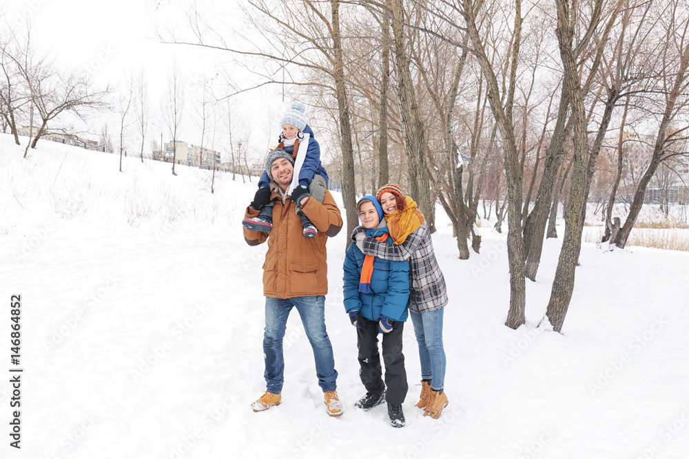 Happy family in winter park