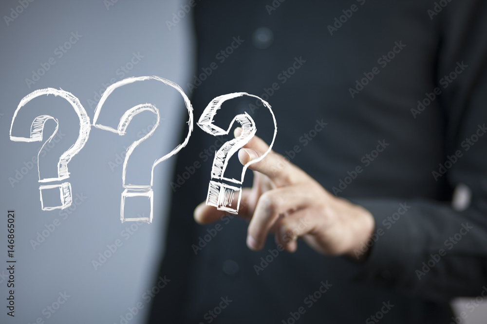 © ARAMYAN - businessman hand  question mark