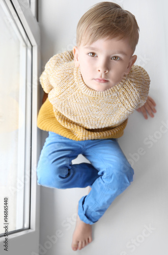 Cute little boy sitting on ...