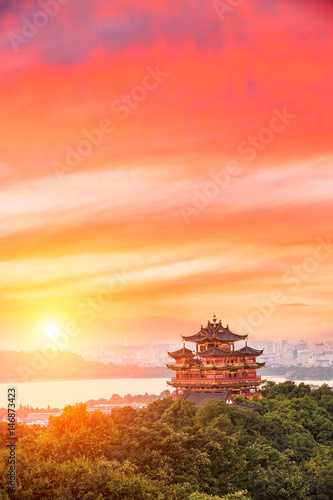 Beautiful Hangzhou West Lake and ancient pavilion architectural scenery at sunset
