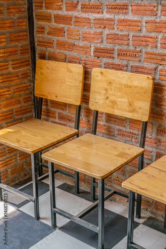 Wooden chairs in coffee shop .