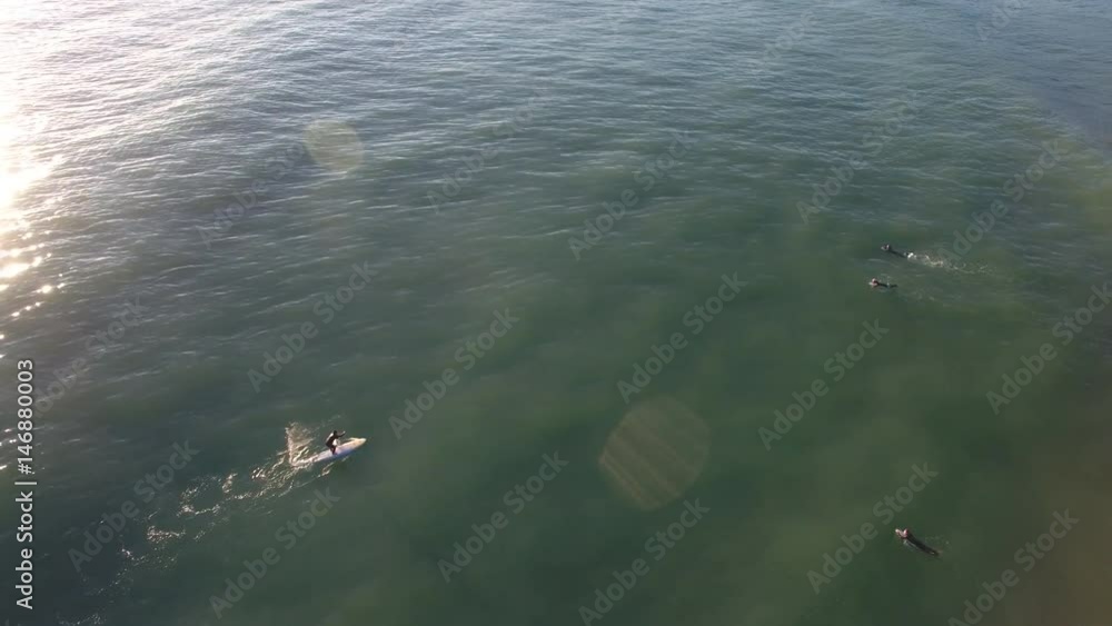 Aerial view of standup paddle surfing (SUP) a wave Aerial view of standup paddle surfing (SUP) a wave