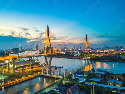 Beautiful sunset view from a drone of Bhumibol Bridge in Bangkok , Bridge of transportation for import , export , Bangkok ,Thailand