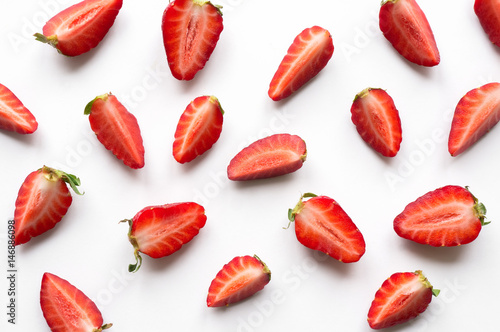 Sliced ripe strawberry background. Isolated berries. Flatlay.