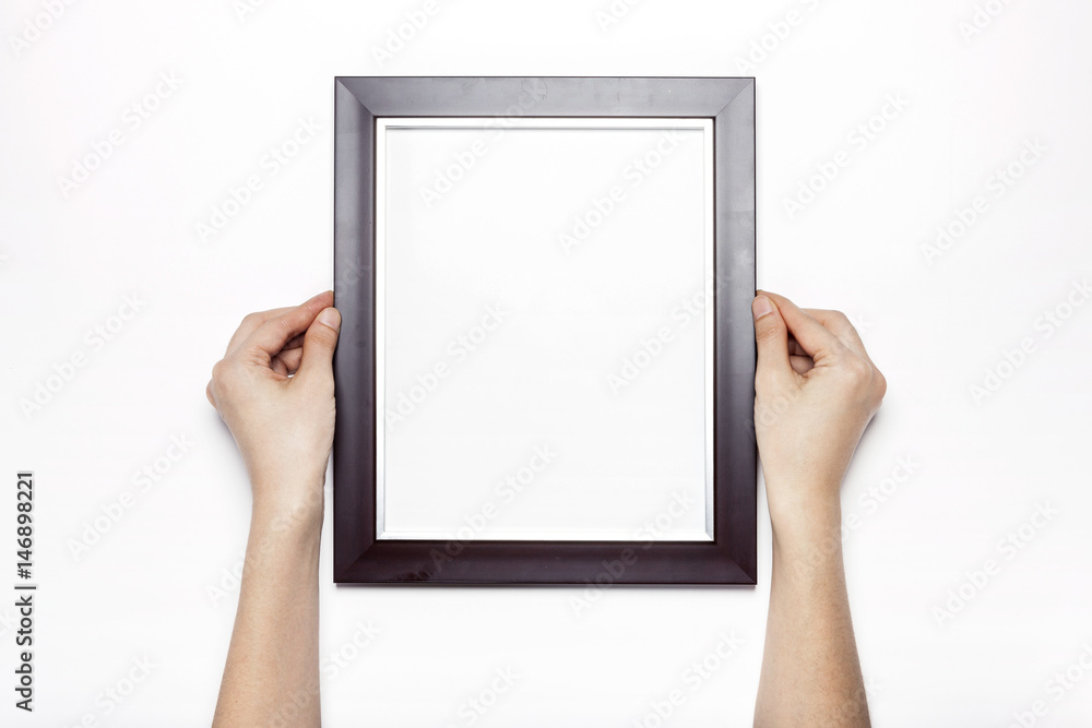 woman hand hold a photo frame isolated white. woman hand hold a photo frame isolated white.