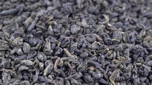 Chinese gunpowder (pearl) green tea - macro turning background