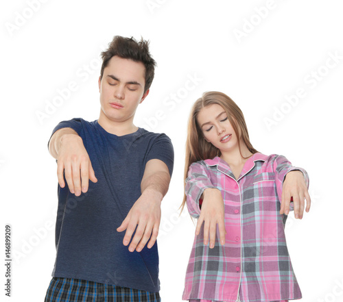Young sleepy couple sufferi...