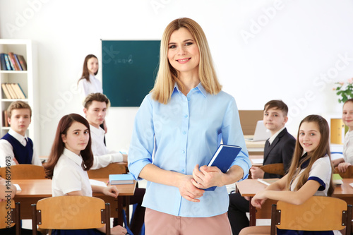 Female teacher with noteboo...
