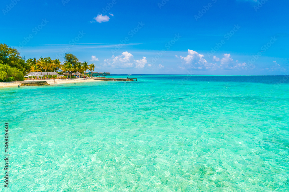 Beautiful tropical Maldives island with white sandy beach and sea .