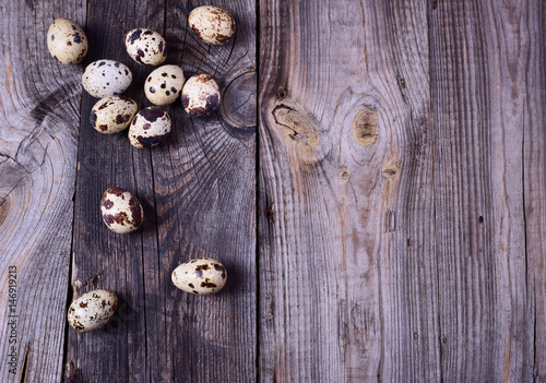 quail eggs on a gray wooden surface