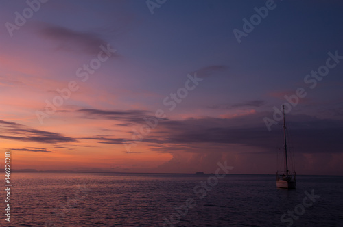 Sunset near the boat © Jesada