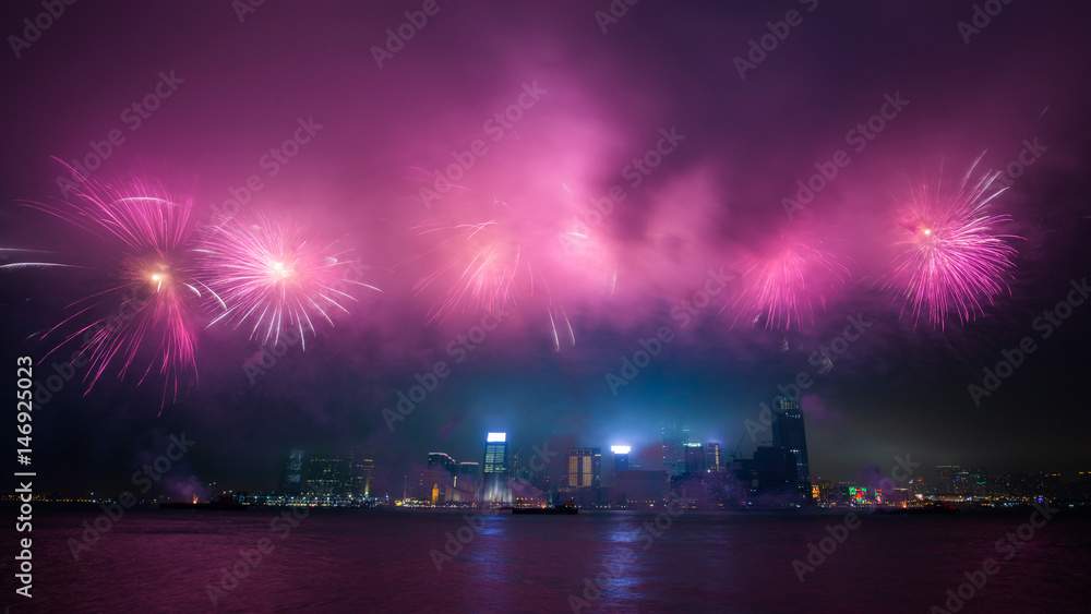 Fireworks show along Victoria harbor in Hong Kong, China.