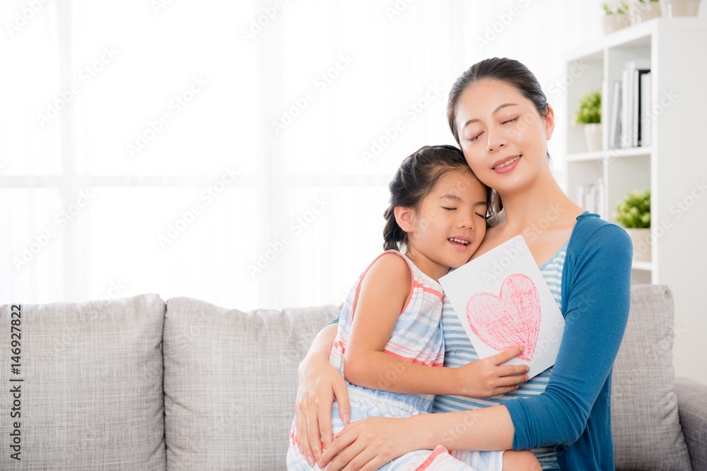 beautiful mom holding lovely little daughter hug beautiful mom holding lovely little daughter hug