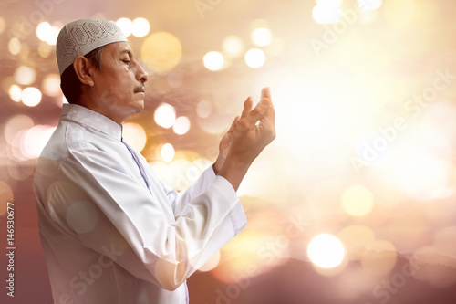 Old muslim man praying