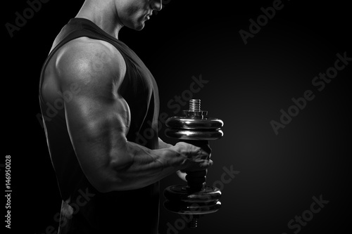 Photos Close-up of a power fitness man Handsome power athletic man in training pumping