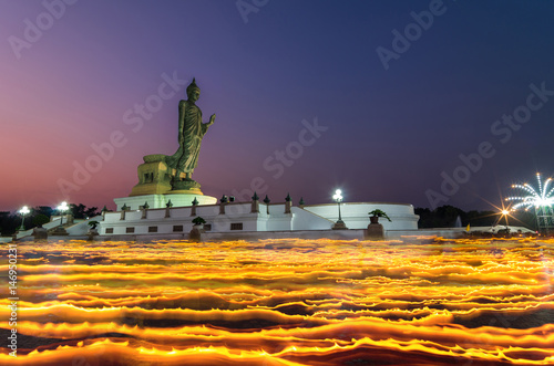 Makha Bucha Day, Candle lit from buddhists are moving around Buddha statue at the Phutthamonthon temple, Nakhon Pathom Province of Thailand photo