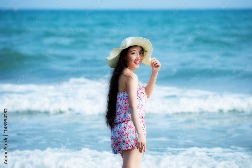 Portrait of young Laos woman wearing hat and bikini enjoy on the tropical beach Rayong Thailand. Portrait of young Laos woman wearing hat and bikini enjoy on the tropical beach Rayong Thailand.