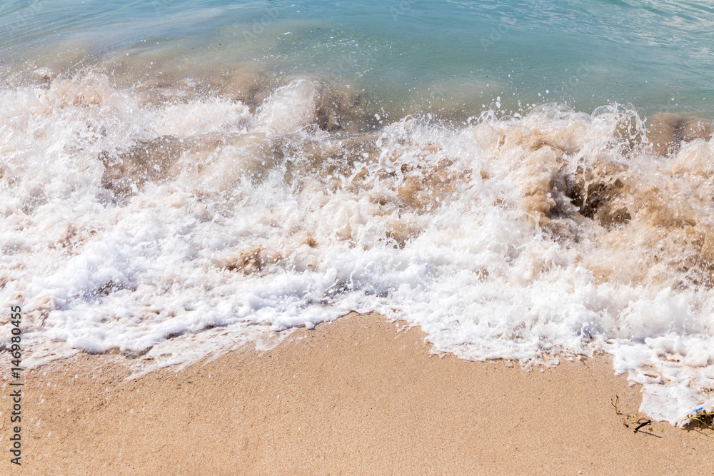 Ocean waves on a tropical beach of magic Bali island, Indonesia.