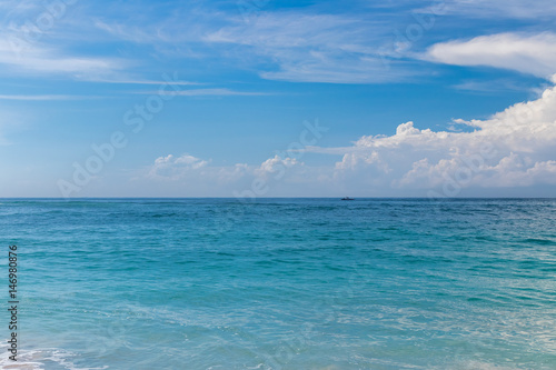 Ocean waves on a tropical beach of magic Bali island, Indonesia.