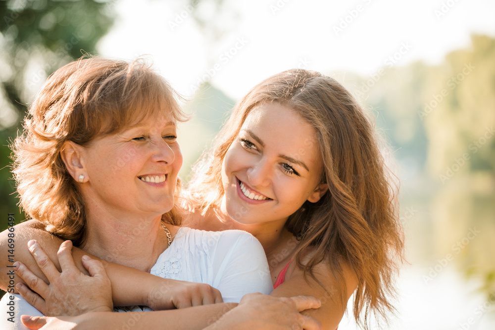 Happy together - mother and teenage daughter outdoor