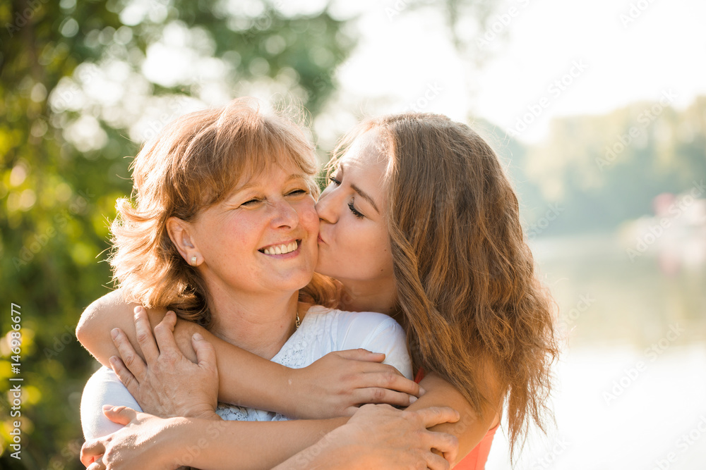 Happy together - mother and teenage daughter outdoor - obrazy, fototapety, plakaty 