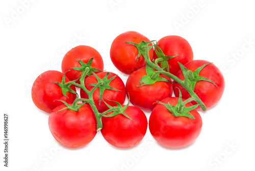 Two branches of the ripe red tomatoes